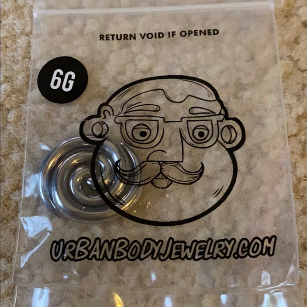 Unopened six gauge spiral earrings